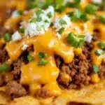 loaded nacho bar with ground beef and queso - featured image